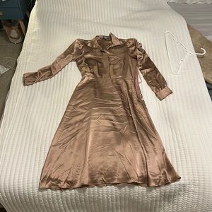 This is a rose gold silk dress. It is Antonio Melani and has only been worn once